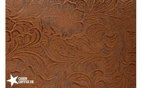 Leather background with floral design. 