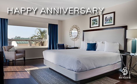 eGift Card image of hotel suite with the text “Happy Anniversary” and The DeSoto logo