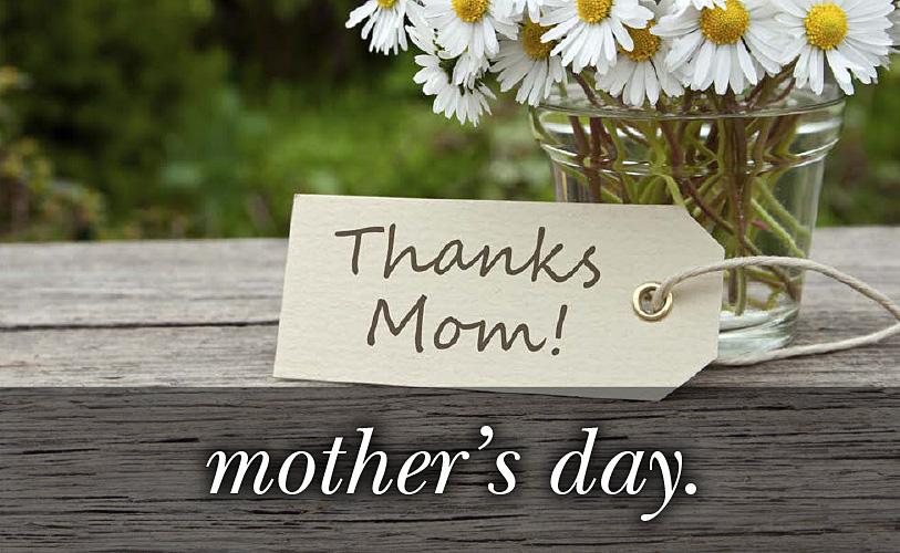 Image of flowers in a vase with a note Thanks Mom and the text 