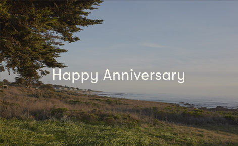 Gift card image of the shore looking out to the ocean with the text “Happy Anniversary”