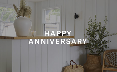 Gift card image of the interior of a room with the text “Happy Anniversary” 