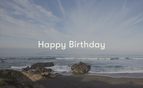 Gift card image of the view from the beach looking out across the ocean with the text “Happy Birthday” 