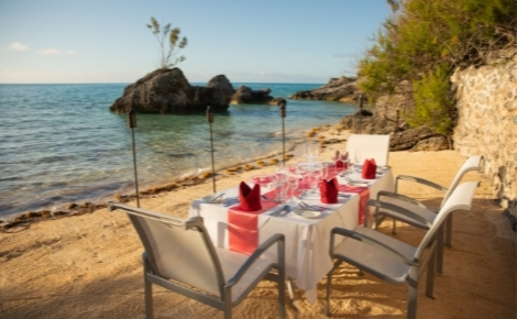 Gift card image of dining table setup on the beach